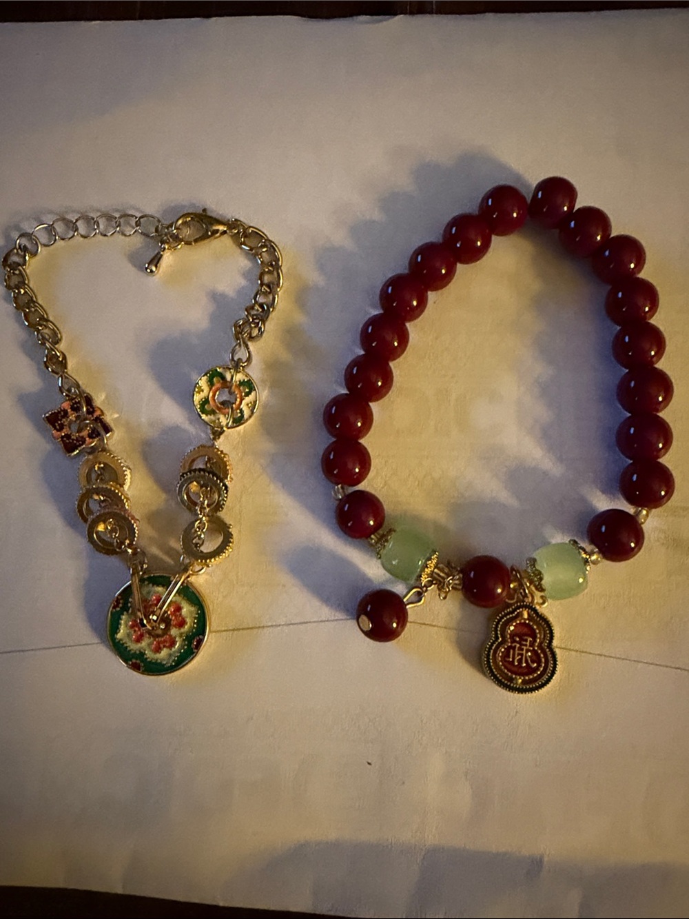 Oriental Red Beaded Stretch Bracelet with Green Accents and Gold Charm
